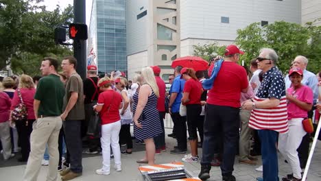 People-gather-to-hear-and-see-President-Donald-Trump-at-a-political-rally