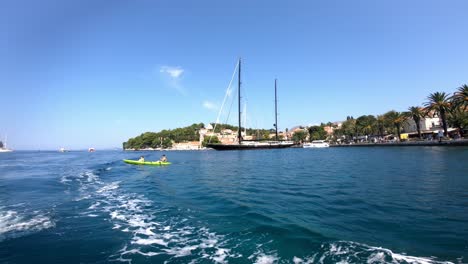 Beautiful-riviera-in-Cavtat,-near-Dubrovnik,-from-one-of-the-boats-onto-kayak-and-yachts-docked-in-town