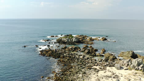 Brazilian-rocky-coastline,-Praia-Armacao,-Florianopolis,-Santa-Catarina,-Brazil