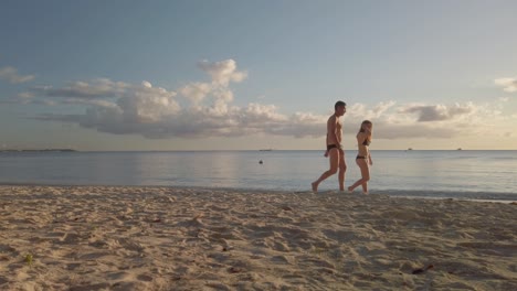 A-father-and-his-daugther-walking-along-the-shore-in-the-Monte-public-beach-in-Maurithius