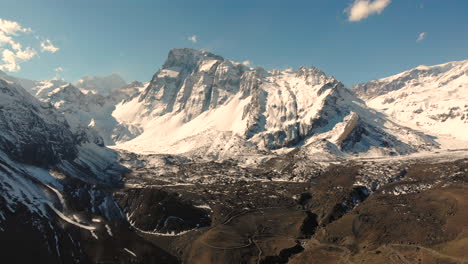 Beautiful-Aerial-Shot-closing-on-Snowy-Mountain-Range-at-Cordillera-de-los-Andes,-Chile-4K
