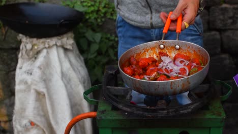 A-slow-motion-shot-of-a-street-vendor-frying-Chilly-Chicken-and-adding-onions-to-sell-in-the-streets-of-Darjeeling