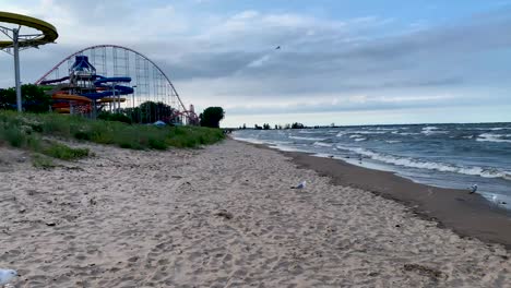 Panoramic-view-of-Cedar-point-water-slides-and-roller-coaster-view-with-dramatic-sky-cloudy-background