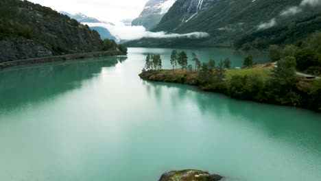 Flying-over-small-islands-in-the-beautiful-lake-Loen,-western-Norway