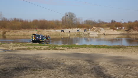 Old-small-ferry-boat-crossing-Vistula-River-near-Krakow