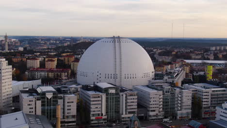 Close-up-orbit-drone-shot-of-Ericsson-Globe-overcast-fall-afternoon