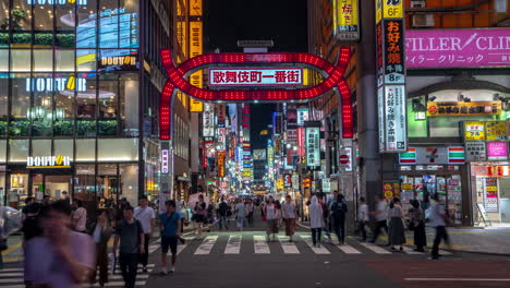 Timelapse-of-People-and-Night-Traffic-in-Front-of-Pedestrian-Street-in-Shinjuku,-Tokyo-Japan,-Urban-Nightlife