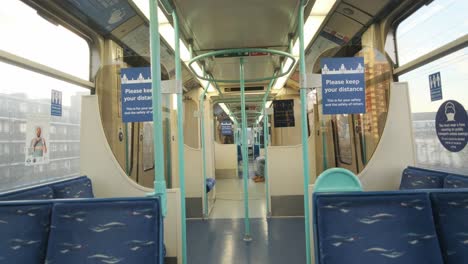 Inside-quiet-London-DLR-train-coronavirus-guidelines-social-distancing