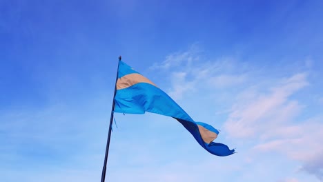 The-country-flag-of-Szekler-waving-in-the-wind-against-a-blue-sky