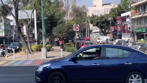 slow-motion-shot-of-mexico-city-streets-with-rainbow-crosswalk