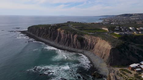 Panoramic-aerial-view-of-stunning-Dana-point-sea-cliffs-and-ocean-waves