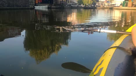 Reflection-on-the-water-canal-from-a-kayak-of-bridge-in-Camden-Lock,-London