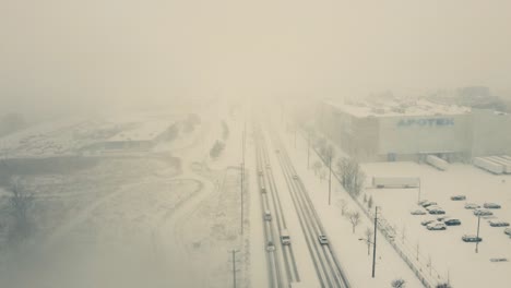 Aerial-view-snowstorm-and-whiteout-in-Canadian-city-during-winter