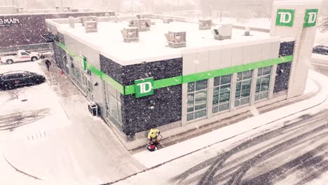Drone-shot-TD-Bank-building-in-Toronto-city-during-heavy-snow-storm