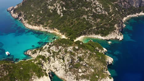 Hidden-gem-of-a-beach-in-Greece,-aerial-rotating-shot
