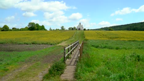 Wide-shot-of-a-small-church-in-a-yellow-field