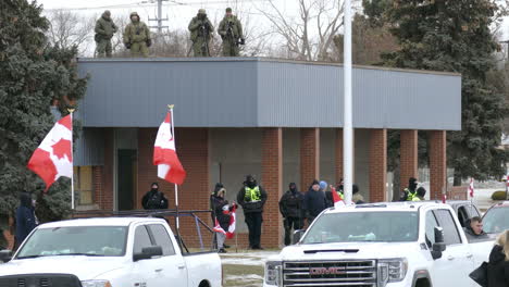 Freedom-Convoy-protestors-in-Canada-gathered-by-a-building,-protesting-against-vaccine-mandates