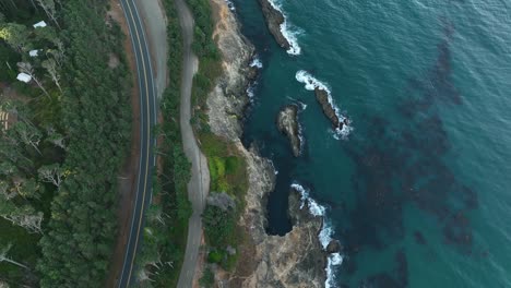 Top-down-drone-shot-of-the-scenic-highway-along-California's-coastline