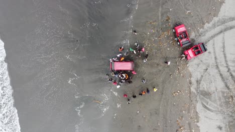 Indonesia---Feb-5,-2023-:-a-car-stuck-in-the-sand-by-the-beach-in-Indonesia