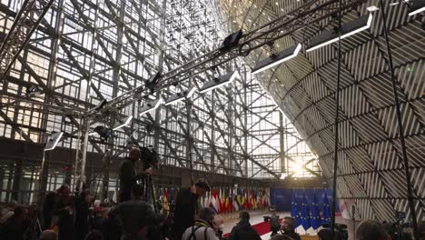 Media-waiting-for-journalistic-assignment-in-the-Europa-building-in-Brussels,-Belgium---Concept-of-journalism,-press,-news,-current-affairs