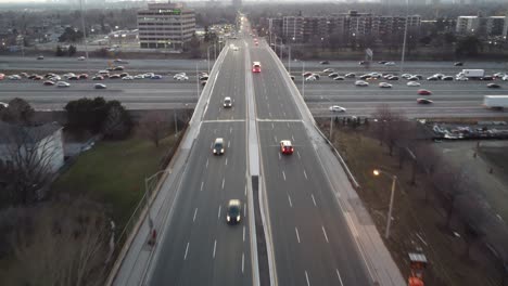 aerial-push-in-shot-to-Burnhamthorpe-Rd-chasing-two-fire-trucks-during-heavy-traffic-right-before-sunset