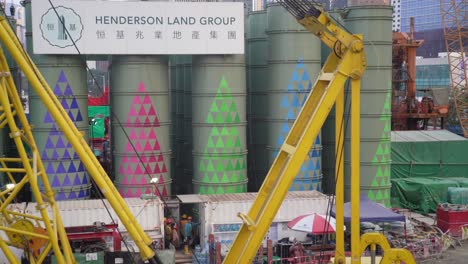 Construction-workers-and-cranes-on-construction-site,-Hong-Kong