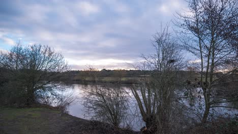 A-stationary-timelapse-shot-of-the-River-Little-Ouse-riverbank-in-the-east-of-England-during-sunrise