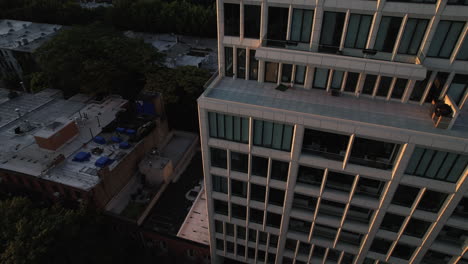 Aerial-view-around-a-sunlit-luxury-apartment,-sunset-in-Brooklyn,-New-York,-USA