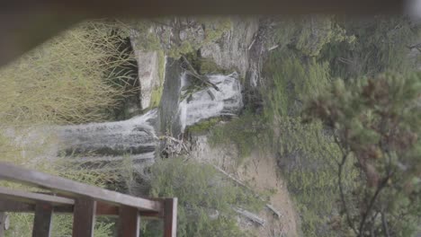 Multiple-waterfalls-in-the-countryside-from-a-wooden-veranda-in-the-rural-landscape-of-Patagonia,-Argentina