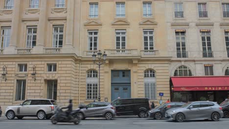 Haussmannian-Building-Facade-In-Rue-Royale-Street-With-The-Famous-Maxim's-Restaurant-In-Paris,-France