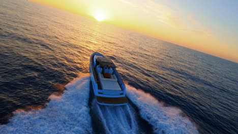 FPV-aerial-view-of-a-luxury-yacht-sailing-into-the-sunset