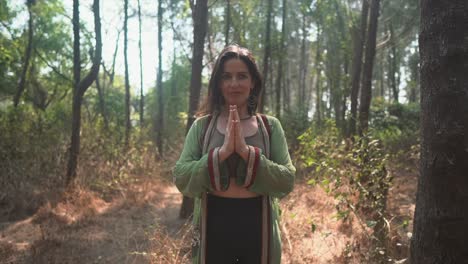Positive-spiritual-brunette-woman-meditating-in-the-forest,-connecting-with-higher-self