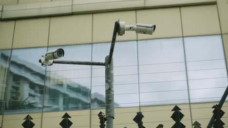 Surveillance-cameras-seen-on-a-buildings-boundary-wall