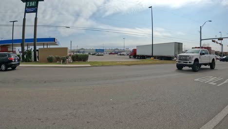 Point-of-view-while-driving-on-Cesar-Chaves-Road-in-Alamo-Texas,-past-the-local-Wal-Mart
