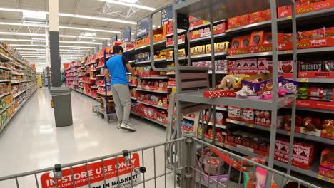POV---Pushing-a-grocery-cart-past-the-displays-of-Valentines-candy-in-an-American-grocery-store