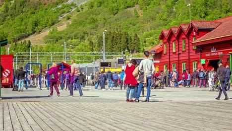 Busy-port-on-a-day-a-cruise-ship-arrives-in-Flam,-Norway---time-lapse