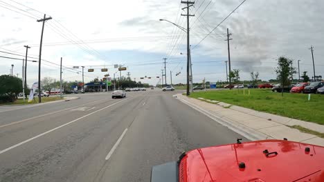point-of-view-while-driving-on-a-four-lane-road-in-Alamo-TX