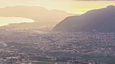 Hazy,-golden-sunrise-time-lapse-over-Palermo,-Sicily-Italy
