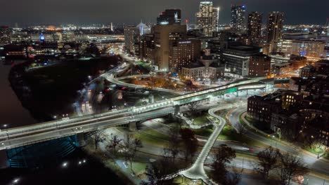 Aerial-hyperlapse-around-the-illuminated-Charles-MGH-station,-night-in-downtown-Boston,-USA