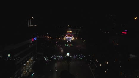 Night-aerial-over-street-decorated-for-New-Year-celebration,-Vietnam
