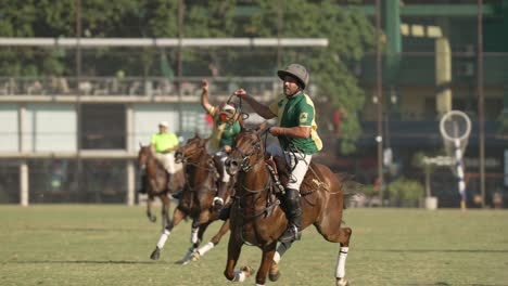 Pato-player-scores-goal-into-netted-hoop-with-ball,-Argentine-horseback-sport