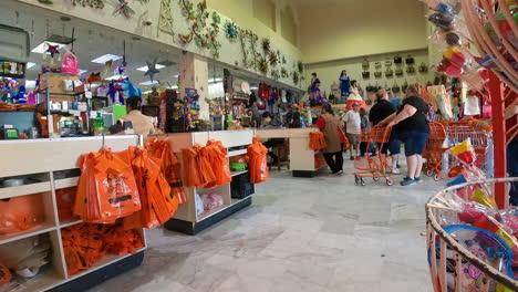 People-milling-about-at-entrance-and-check-out-area-of-a-busy-market-in-near-the-USA---Mexico-boarder