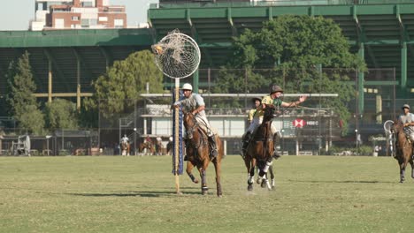 Pato-rider-throws-ball-into-netted-hoop-for-goal---Argentina-national-sport