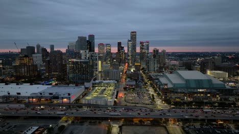 Drone-shot-in-front-of-the-east-skyline-of-Houston,-blue-hour-in-Texas,-USA