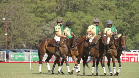 Four-Pato-team-members-on-horseback-chatting-strategy-for-upcoming-game