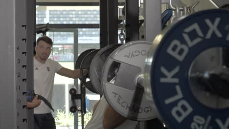 Slow-motion-shot-of-Montpellier-rugby-players-squatting-and-doing-rehabilitation