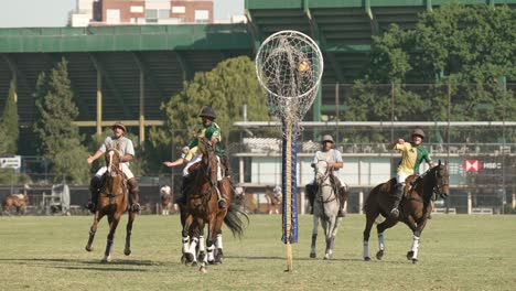 Pato-horseball-sport-tournament,-player-on-horseback,-shooting-the-ball-into-the-hoop-and-score-a-goal-for-the-team,-teammates-cheering,-while-the-opponents-were-disappointed-captured-in-slow-motion