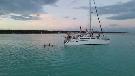 Young-Adults-on-Spring-Break-Holiday-Vacation-on-Sail-Boat-Yacht-in-Mexico---Aerial-Orbit-of-Party