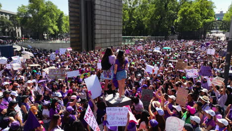 Leaders-talking-on-a-megaphoneto-their-followers-at-a-feminism-riot,-in-Mexico---Aerial-view