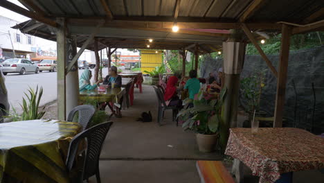 Southeast-asian-open-air-restaurant-with-travelers-and-locals-eating